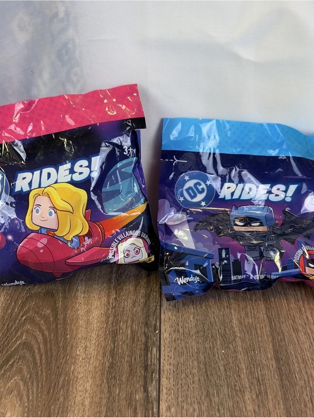 imaginative fun. Pink and blue colors are showcased on the packaging and toys.